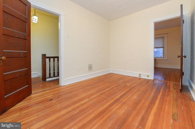 unfurnished room featuring light hardwood / wood-style floors