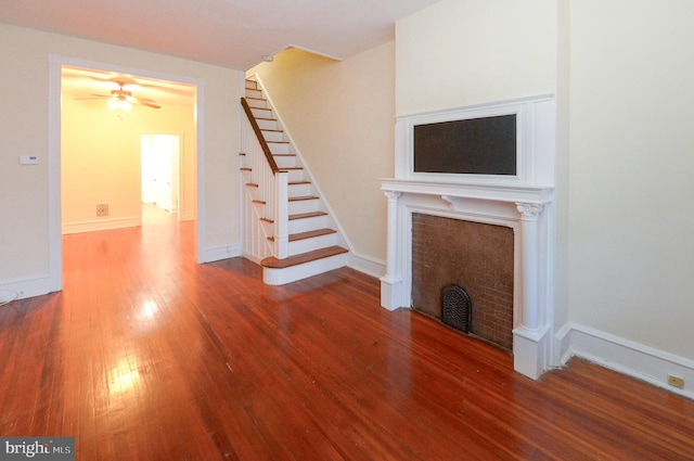 unfurnished living room with hardwood / wood-style floors and ceiling fan