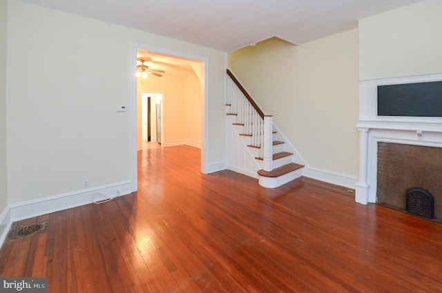 unfurnished living room with hardwood / wood-style floors and ceiling fan