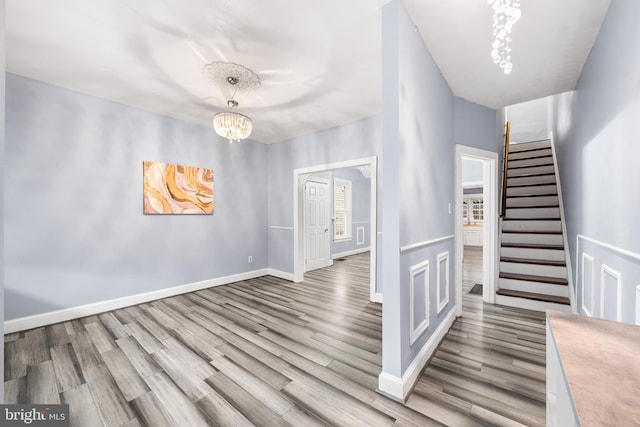 interior space featuring light wood-type flooring and a chandelier