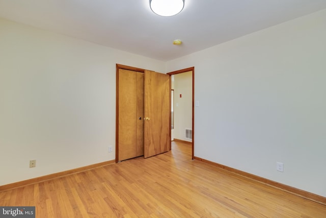 spare room featuring light hardwood / wood-style floors