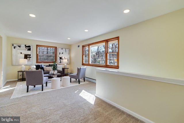 interior space with light carpet and baseboard heating