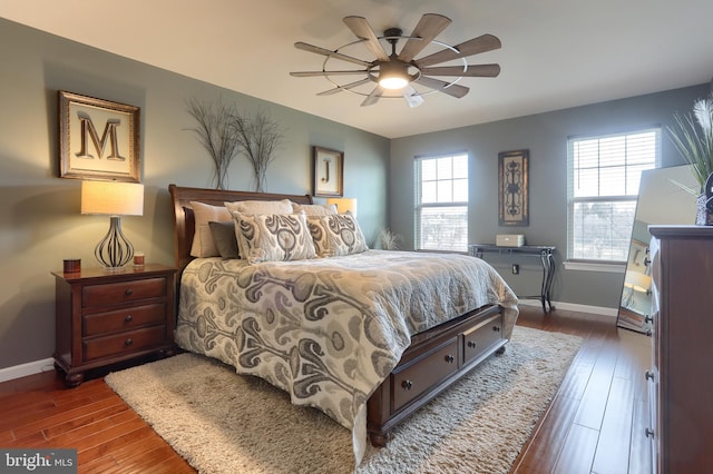 bedroom featuring ceiling fan and dark hardwood / wood-style flooring