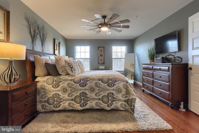 bedroom featuring ceiling fan and dark hardwood / wood-style flooring