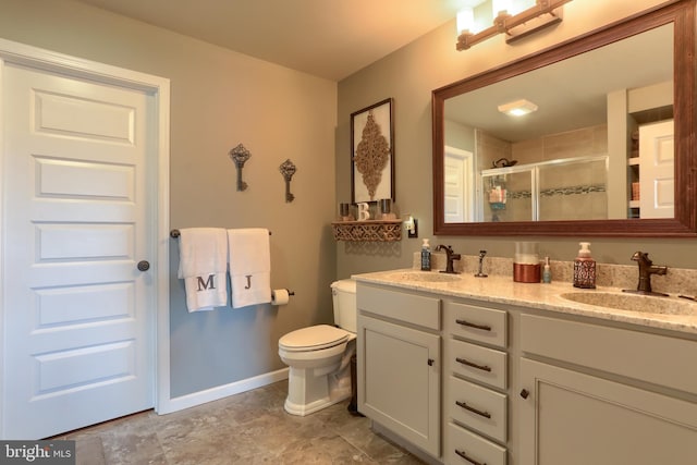 bathroom featuring vanity, toilet, and an enclosed shower