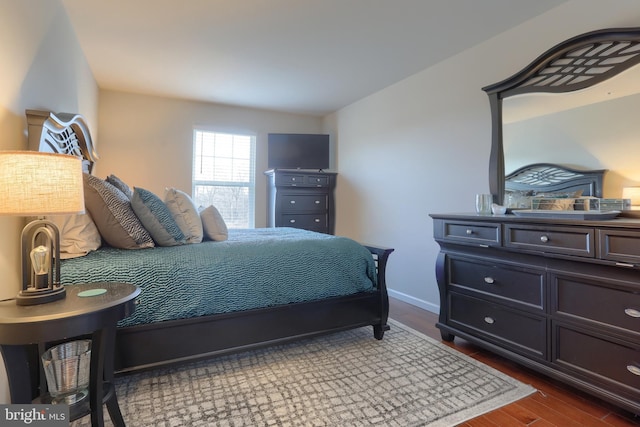 bedroom featuring dark wood-type flooring