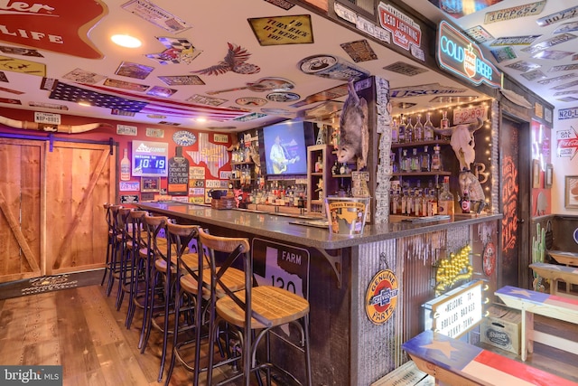 bar featuring hardwood / wood-style floors