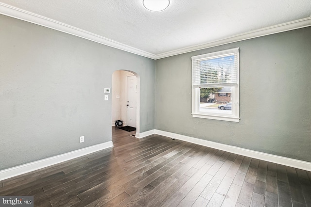 unfurnished room featuring crown molding, dark hardwood / wood-style floors, and a textured ceiling