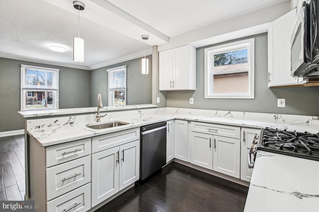 kitchen featuring pendant lighting, sink, stainless steel appliances, white cabinets, and kitchen peninsula