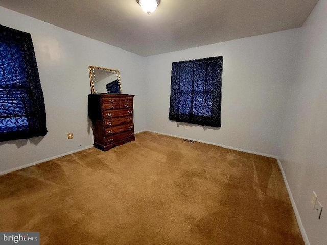 unfurnished bedroom with carpet