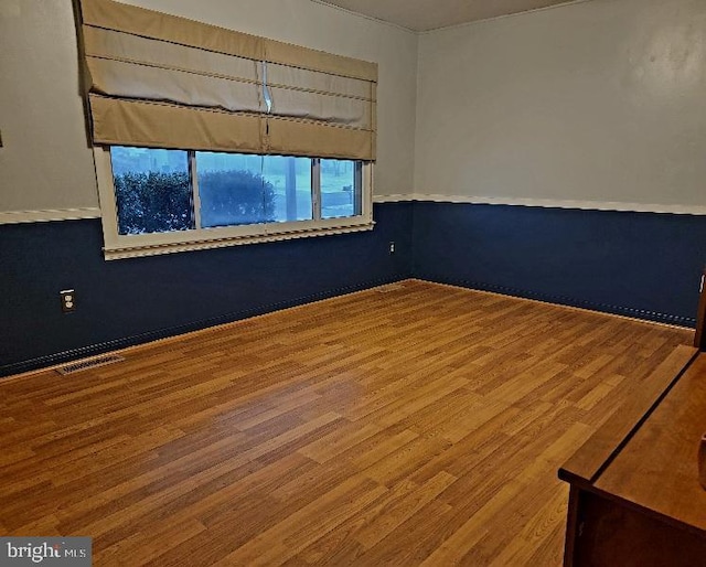 spare room featuring hardwood / wood-style flooring