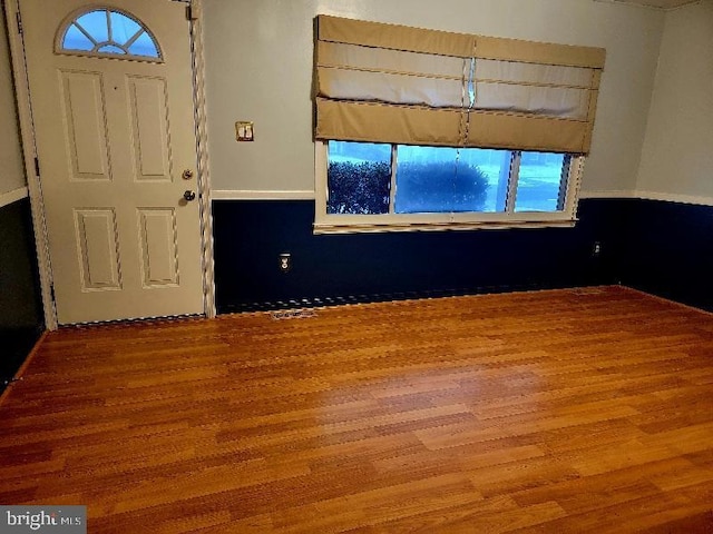 foyer entrance with hardwood / wood-style floors