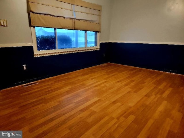 empty room featuring hardwood / wood-style flooring