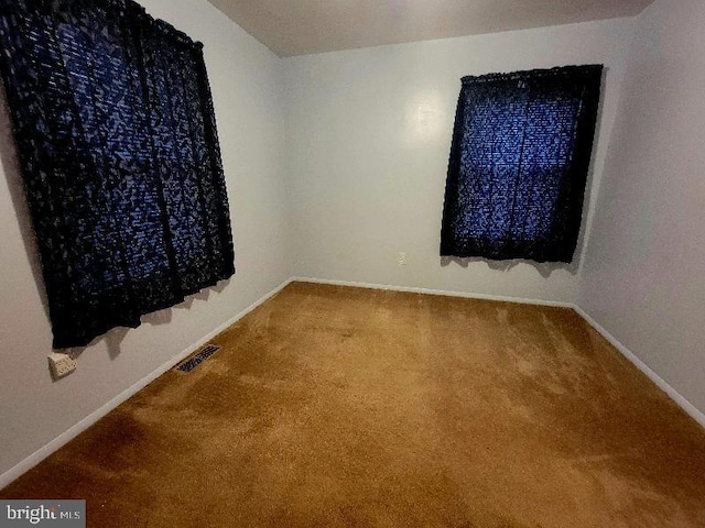 view of carpeted spare room