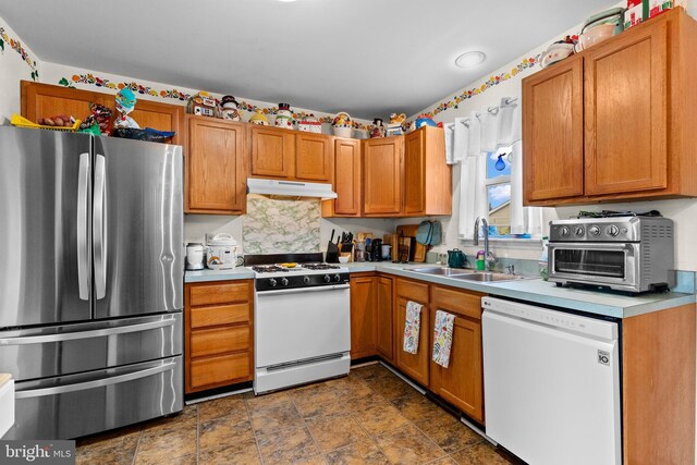 1025 Harmony Hl, Lebanon, PA 17046 - kitchen featuring under cabinet range hood, a toaster, light countertops, white appliances, and a sink