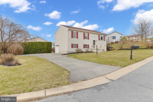 1025 Harmony Hl, Lebanon, PA 17046 - split foyer home with aphalt driveway, a garage, and a front yard
