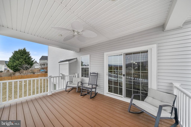 wooden deck with ceiling fan