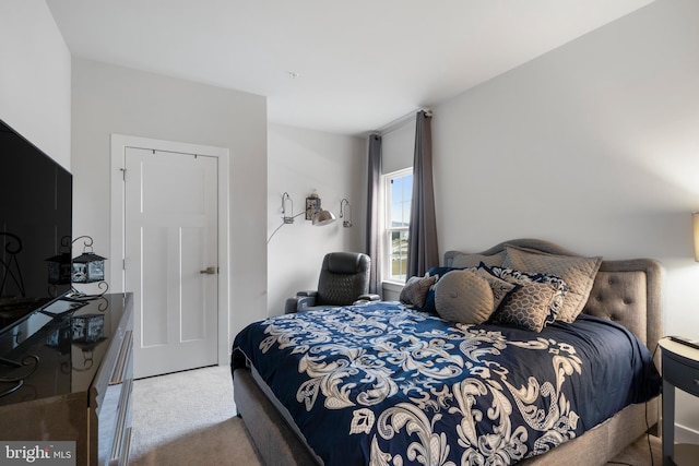 bedroom with light colored carpet