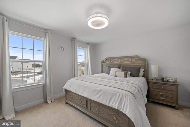 bedroom with light colored carpet