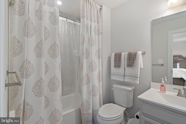 full bathroom featuring toilet, vanity, and shower / tub combo