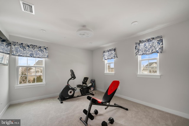 exercise room with carpet flooring