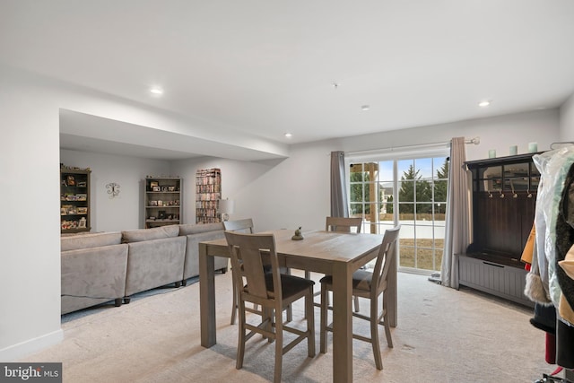 view of carpeted dining space