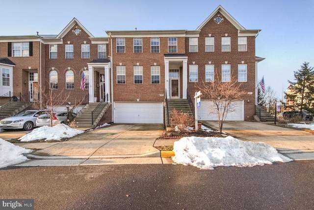 townhome / multi-family property featuring a garage