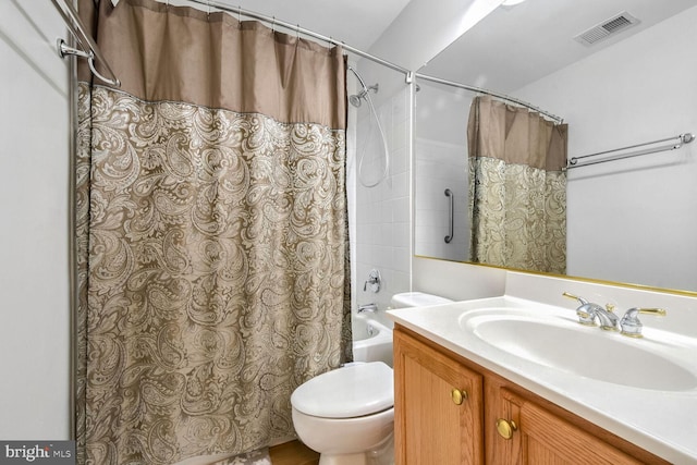 full bathroom featuring vanity, toilet, and shower / bath combo