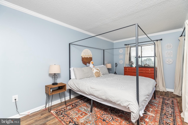 bedroom with crown molding, hardwood / wood-style floors, and a textured ceiling