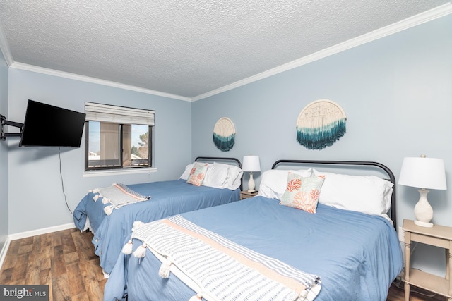 bedroom featuring crown molding, dark wood-type flooring, and a textured ceiling