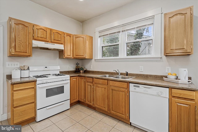 kitchen with light tile patterned flooring, white appliances, and sink