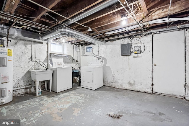 basement featuring sink, electric panel, water heater, and washing machine and clothes dryer