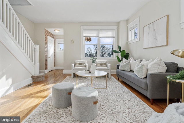 living room with hardwood / wood-style floors and a wealth of natural light