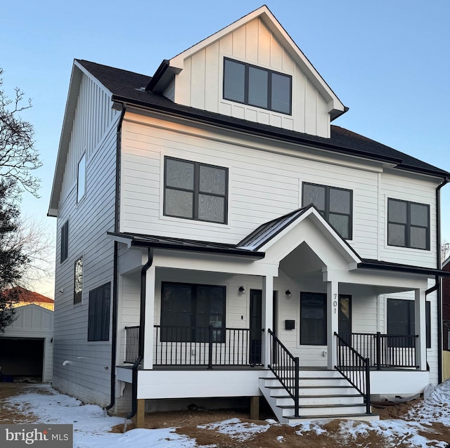 view of front of house with a porch and a garage