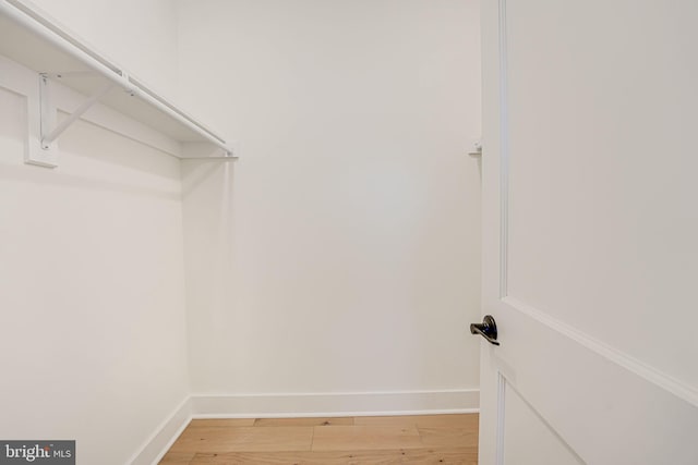 walk in closet featuring hardwood / wood-style floors