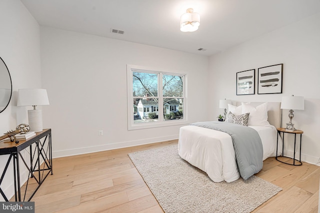 bedroom with light hardwood / wood-style floors