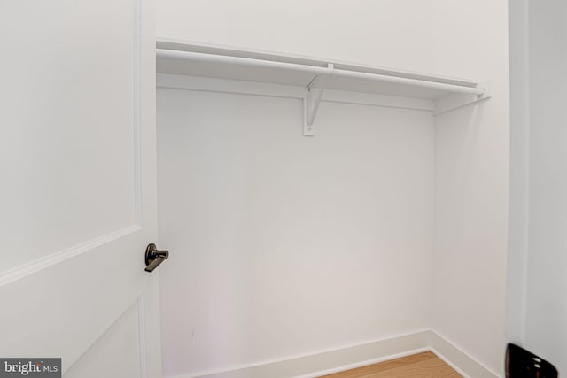 walk in closet featuring hardwood / wood-style flooring