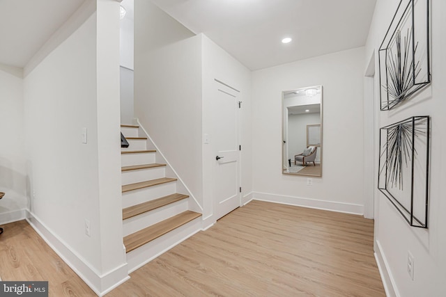 stairway with wood-type flooring