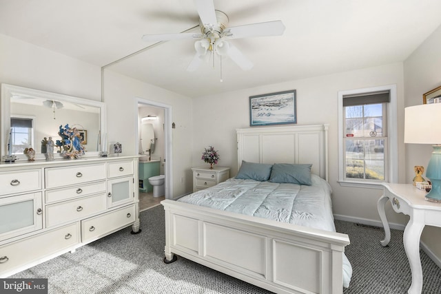 carpeted bedroom featuring ensuite bath and ceiling fan