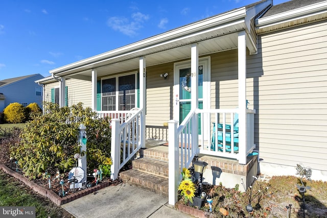 entrance to property featuring covered porch