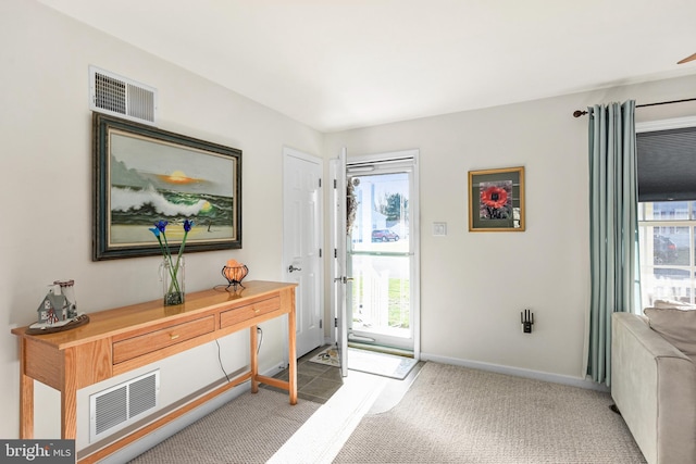 foyer featuring carpet