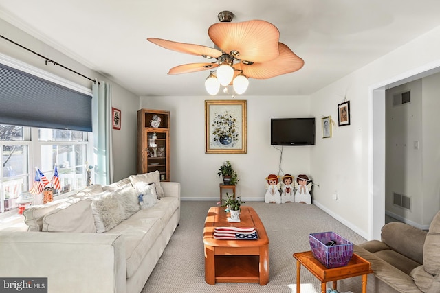 living room with ceiling fan and light colored carpet