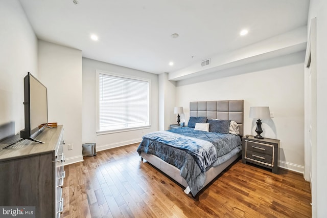 bedroom featuring dark hardwood / wood-style flooring