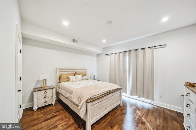 bedroom featuring dark hardwood / wood-style flooring