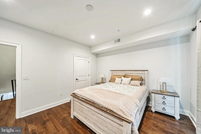 bedroom featuring dark hardwood / wood-style floors