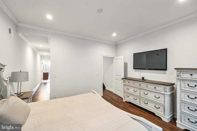 bedroom featuring dark hardwood / wood-style floors and ornamental molding