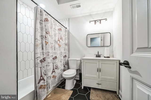 full bathroom with shower / bath combination with curtain, vanity, toilet, and tile patterned floors