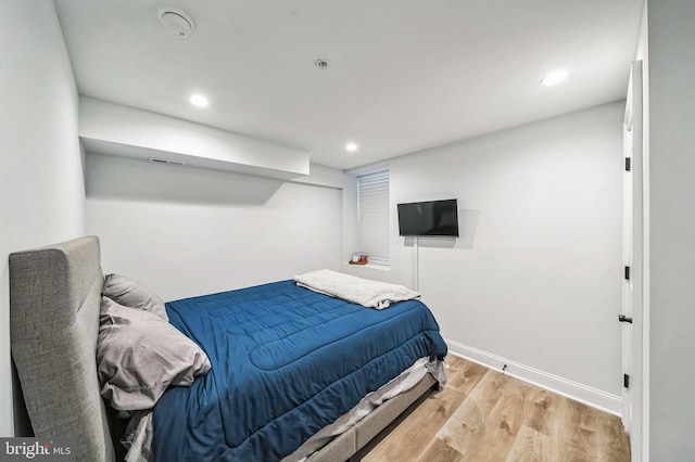 bedroom with light hardwood / wood-style flooring