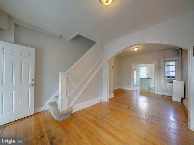 interior space with hardwood / wood-style floors and cooling unit