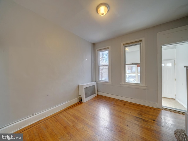 empty room featuring wood-type flooring